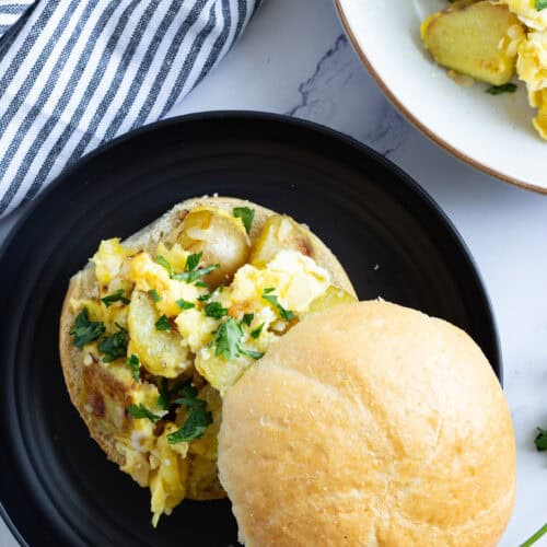 A sandwich roll filled with Italian potatoes and eggs.
