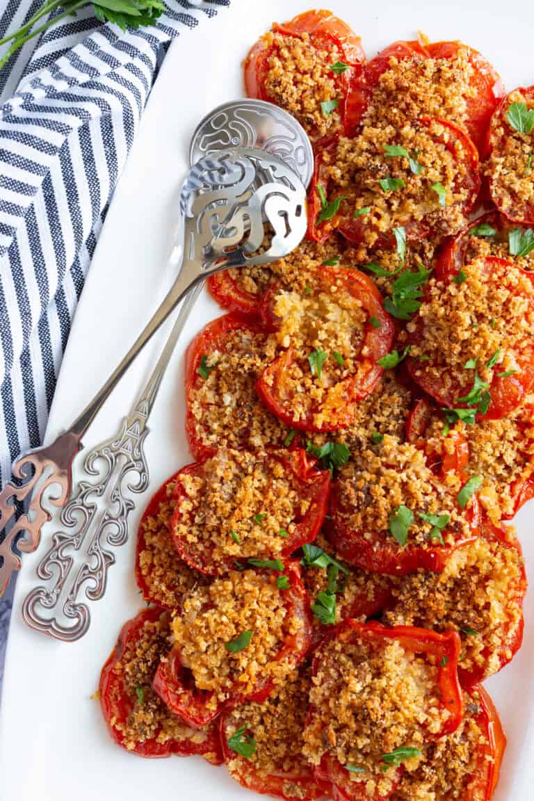 A platter of vine-roasted tomatoes with anchovy breadcrumbs.