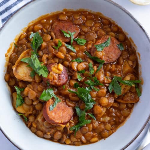 A bowl of chorizo and lentil soup with potatoes (Lentejas).