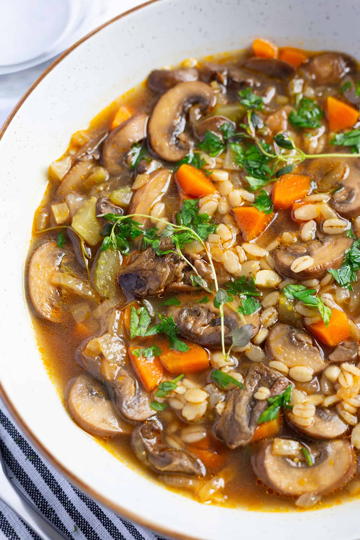 A bowl of the best recipe for mushroom and barley soup.