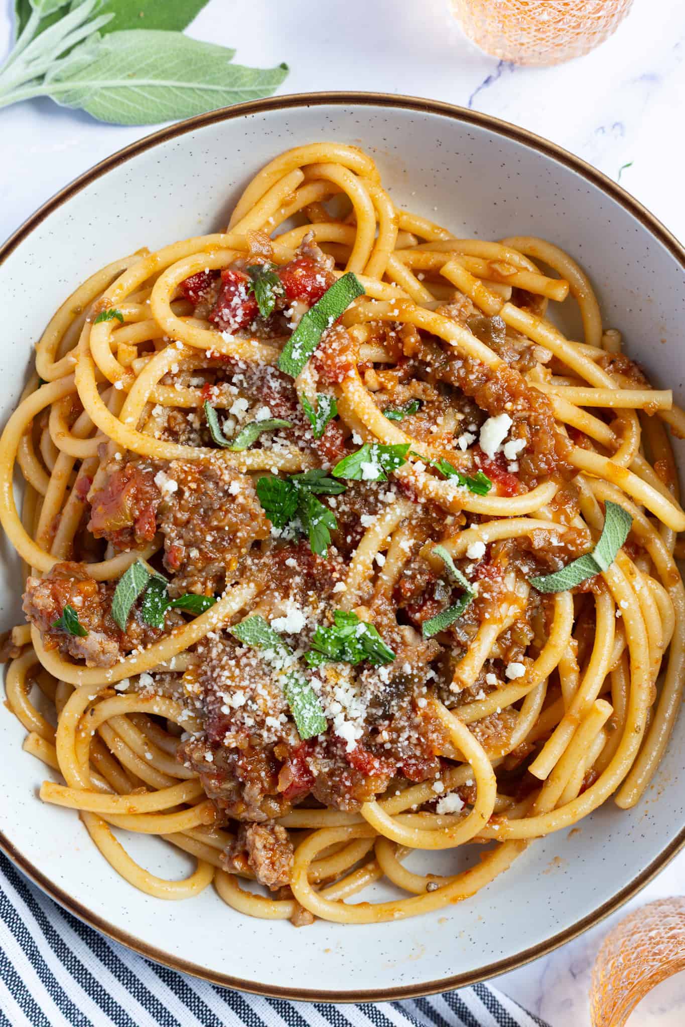 A bowl of bucatini bolognese.