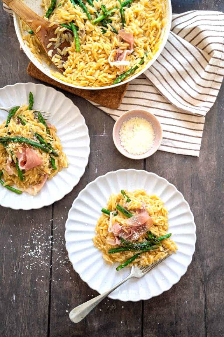 Plates of asparagus orzo.